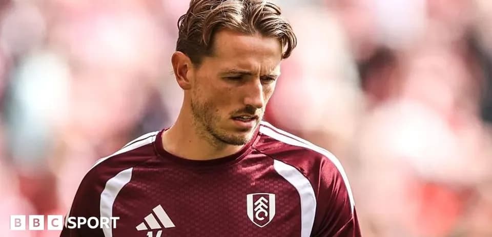 Player in Fulham training kit before a match