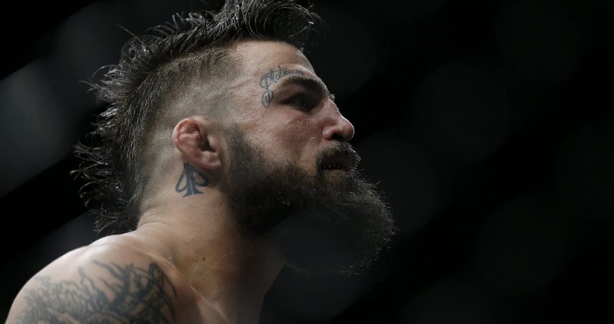 Close-up of a fighter with tattoos in the ring