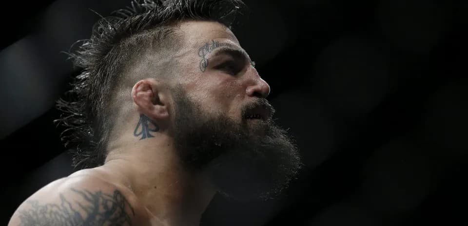 Close-up of a fighter with tattoos in the ring