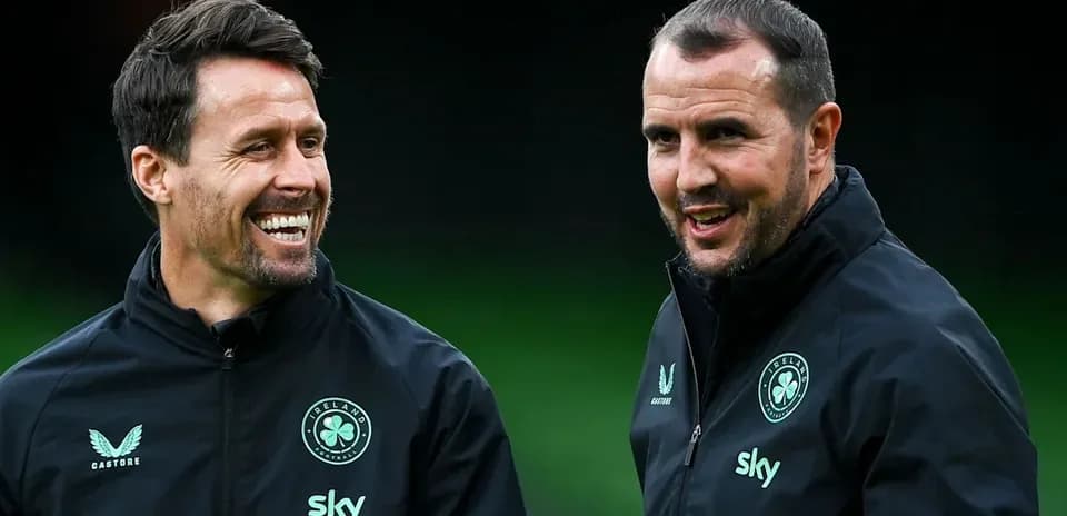 Two coaches talking during training session