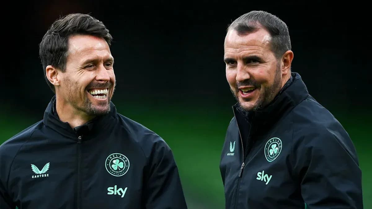 Two coaches talking during training session
