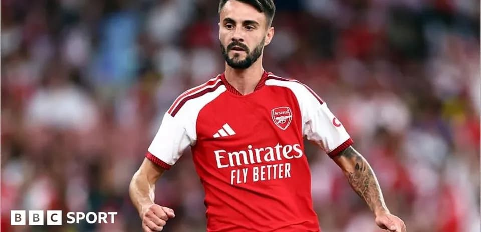 Player in Arsenal kit celebrating during a match