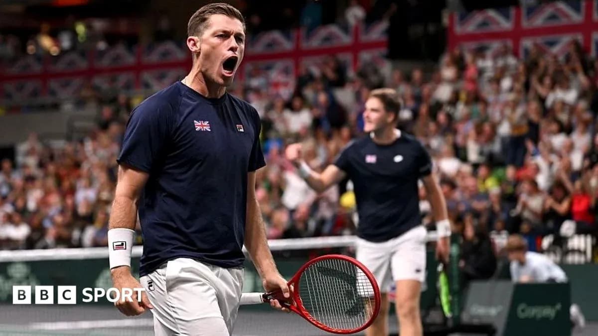 Player celebrating during a tennis match with crowd