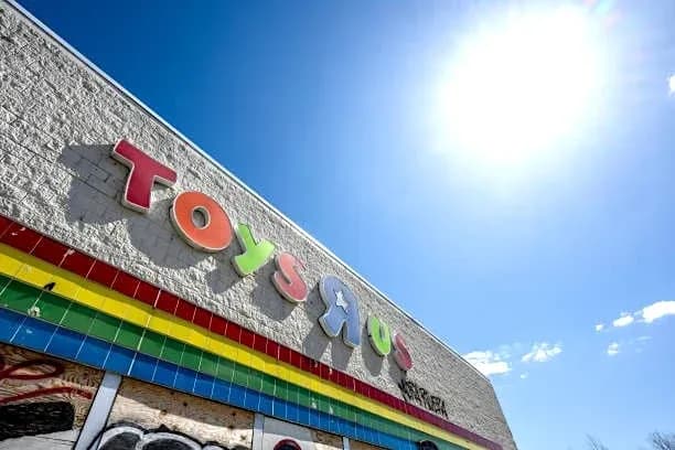 Toys R Us storefront under bright blue sky