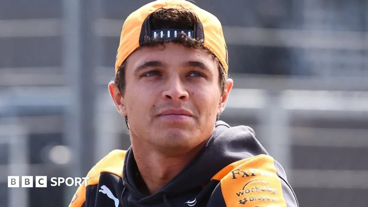 Driver wearing McLaren team gear at track