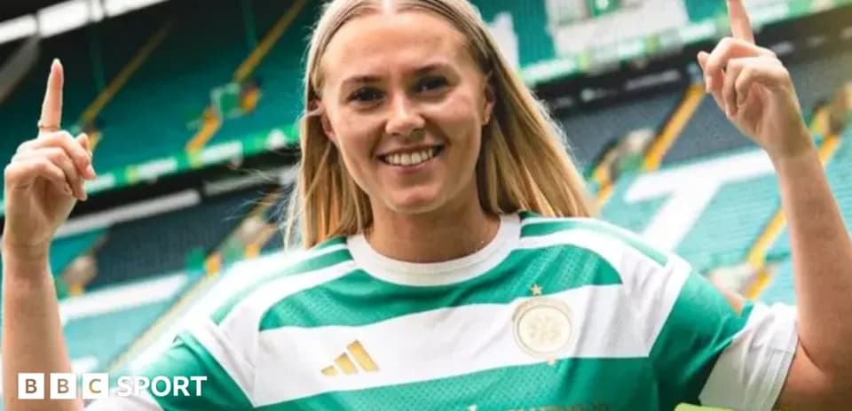 Player celebrating in Celtic kit at stadium