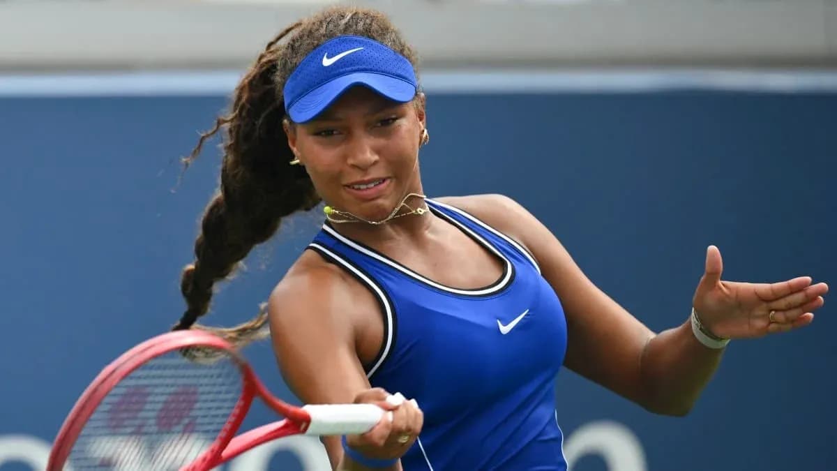 Tennis player preparing to hit a forehand shot