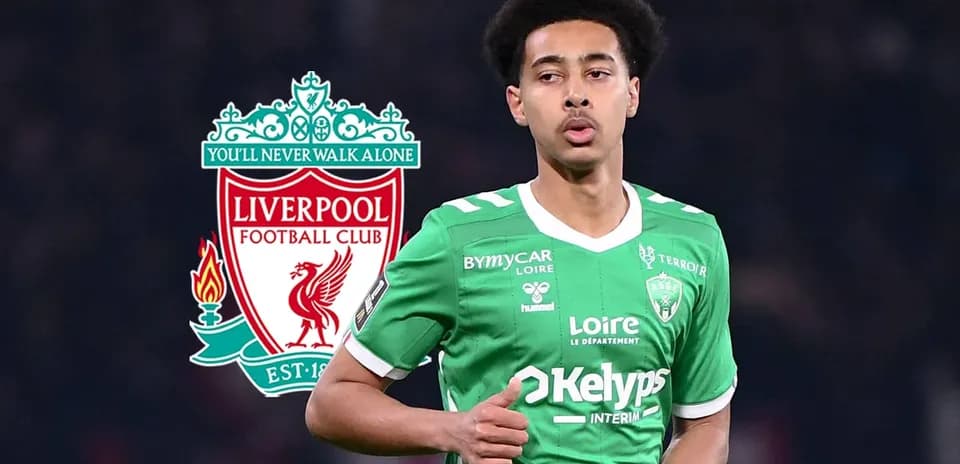 Player wearing green jersey with Liverpool logo background