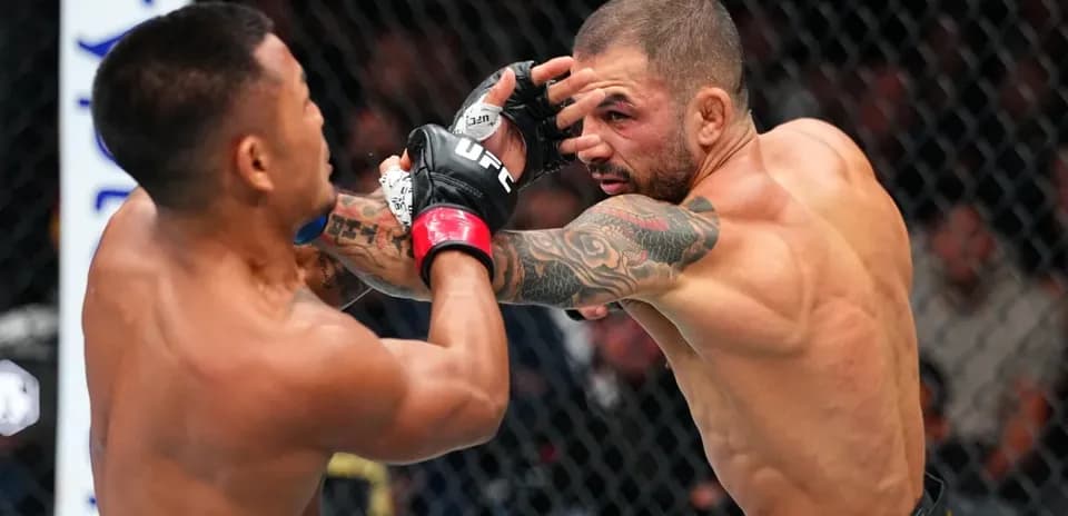Fighters exchanging strikes during MMA match