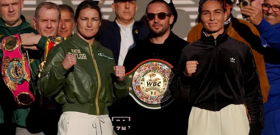 Katie Taylor and opponent at boxing weigh-in event