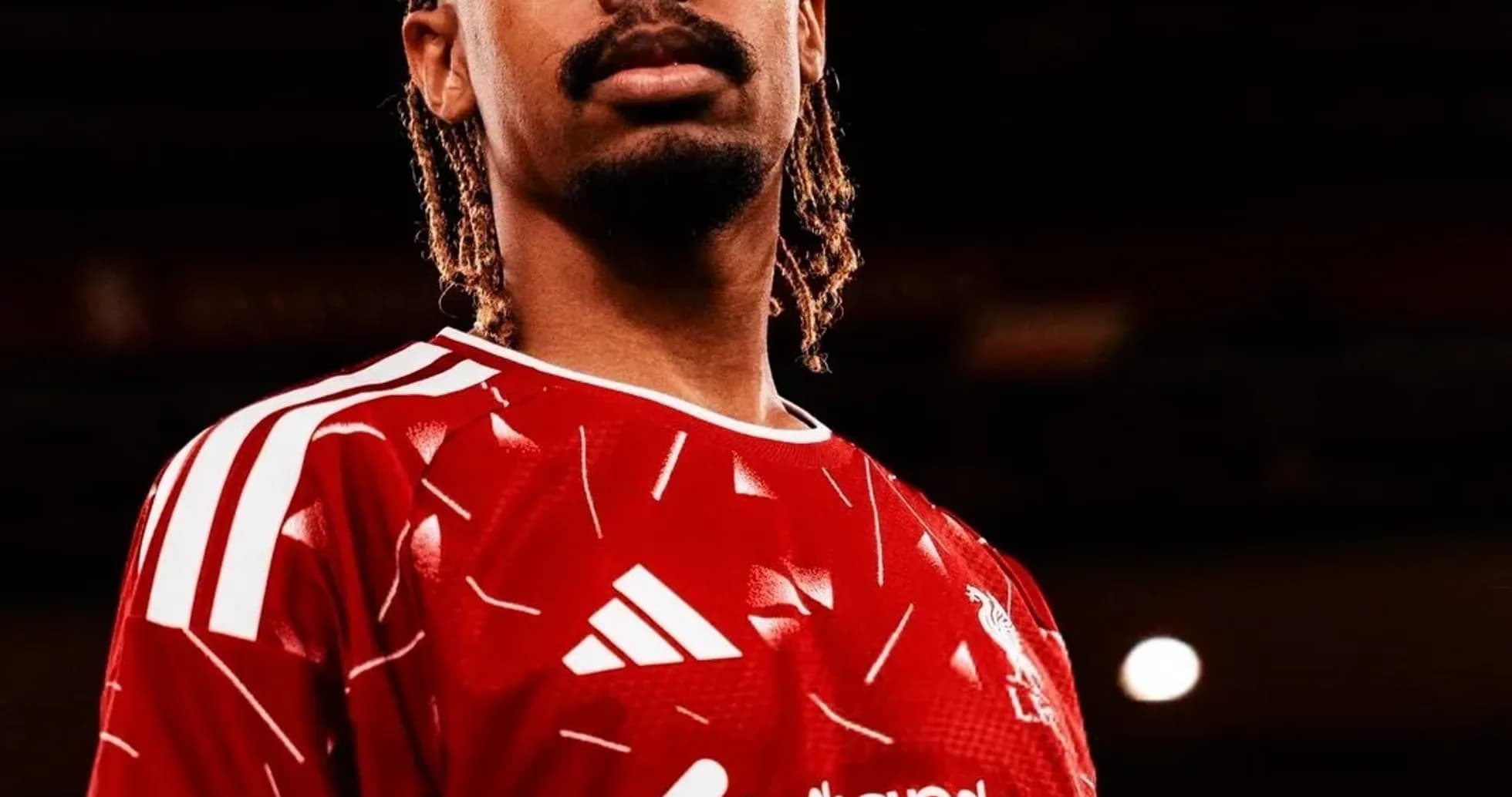 Player in red jersey posing for photo