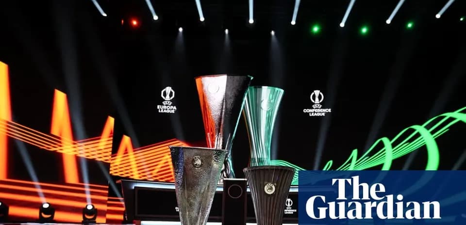 Three UEFA tournament trophies on display