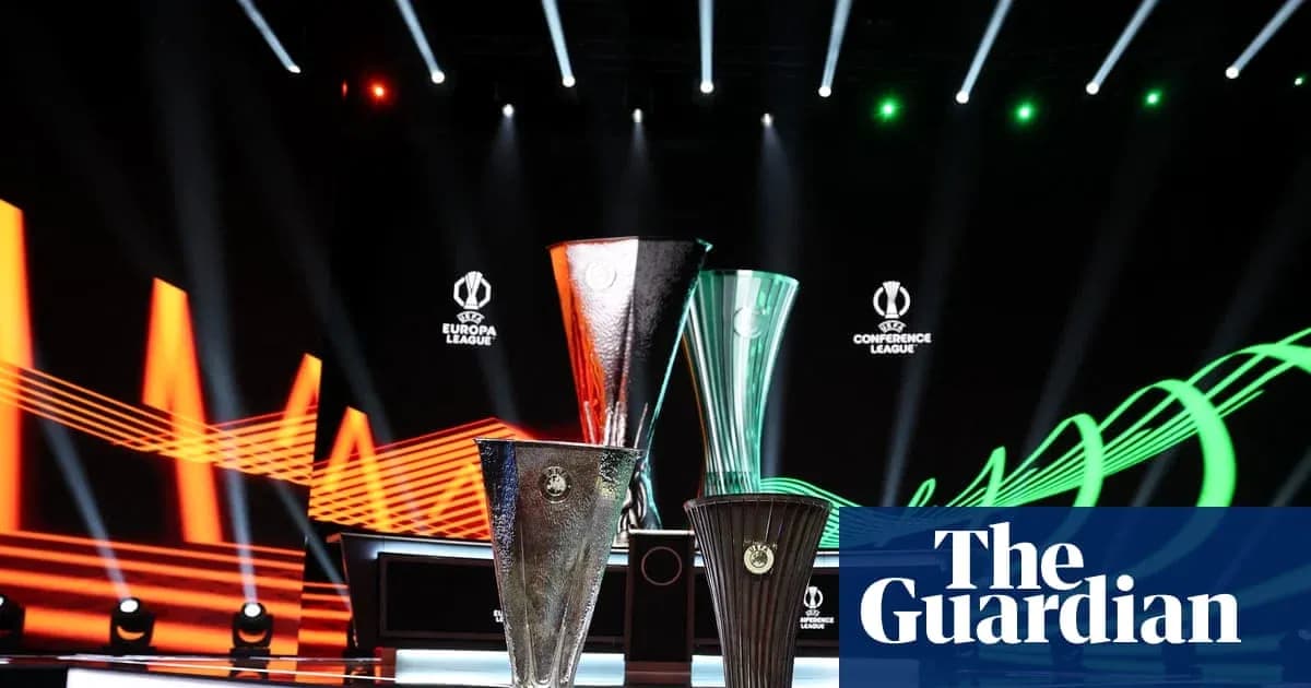 Three UEFA tournament trophies on display