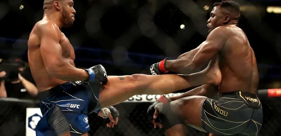 Two fighters exchanging strikes inside the UFC octagon