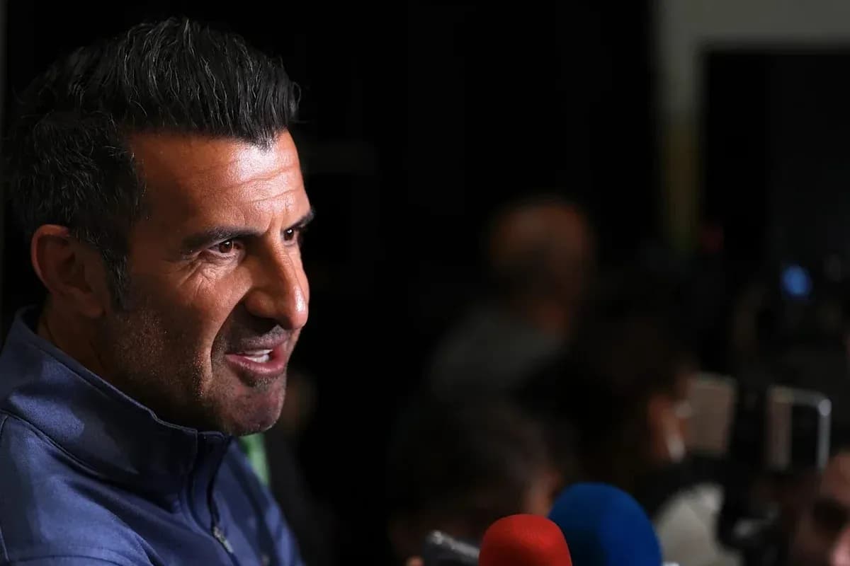 Man speaking during a press conference with microphones