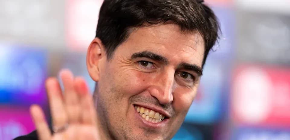 Man waving during a press conference