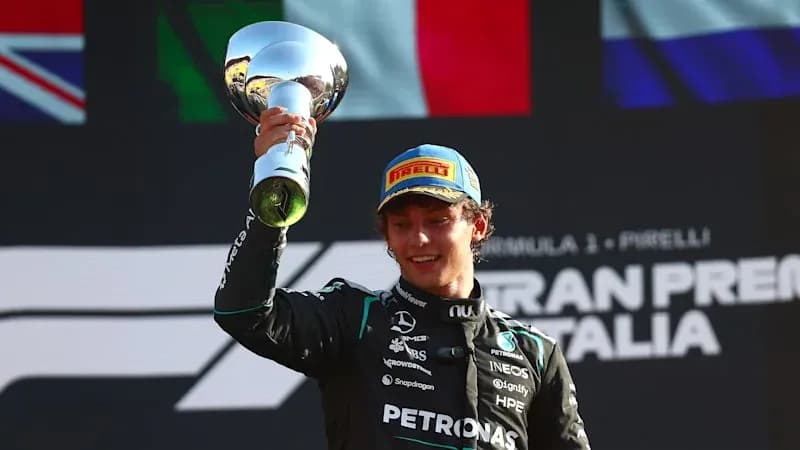 Driver celebrating with trophy at Italian Grand Prix