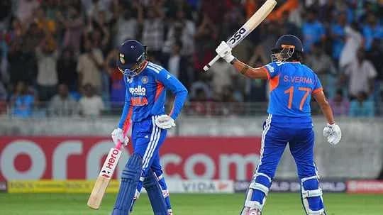 Indian players celebrating after a boundary in cricket match