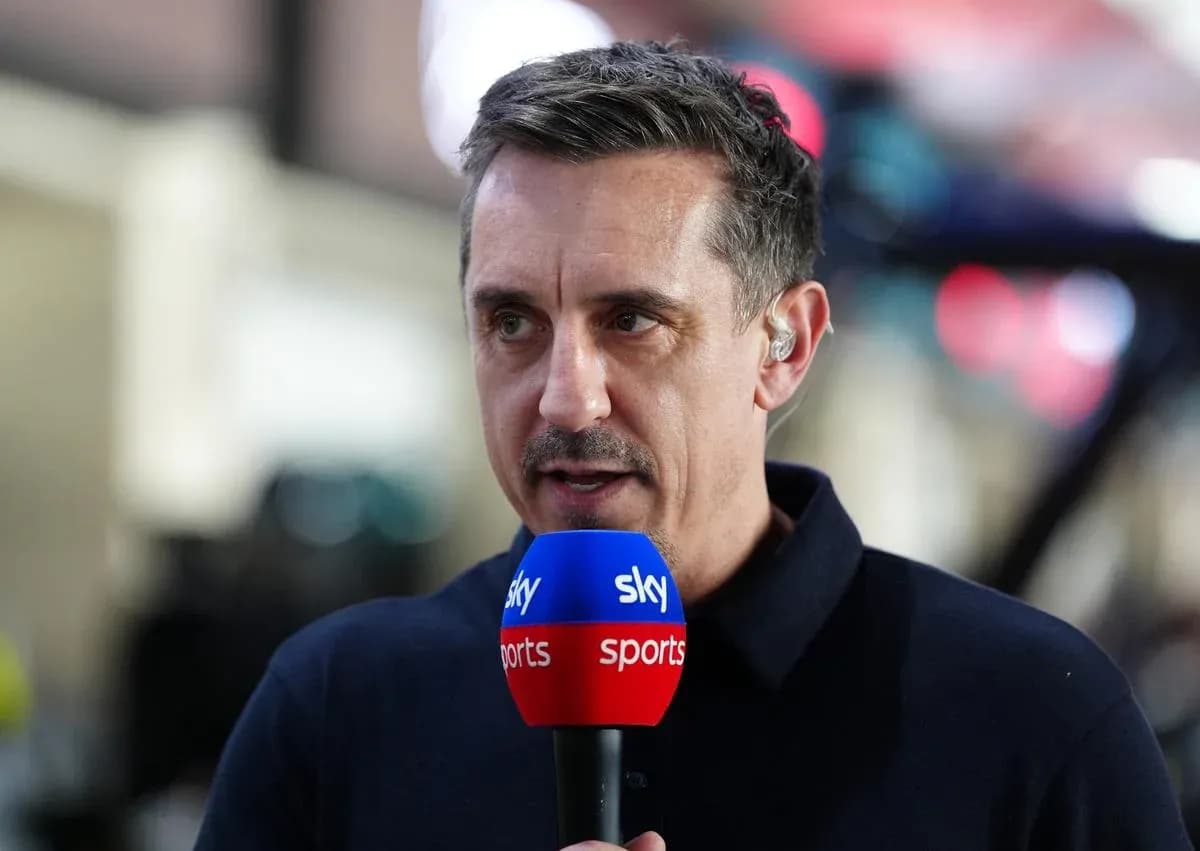 Sportscaster speaking into microphone during broadcast