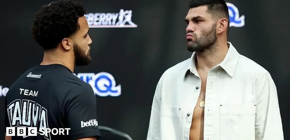 Two boxers facing each other at weigh-in event