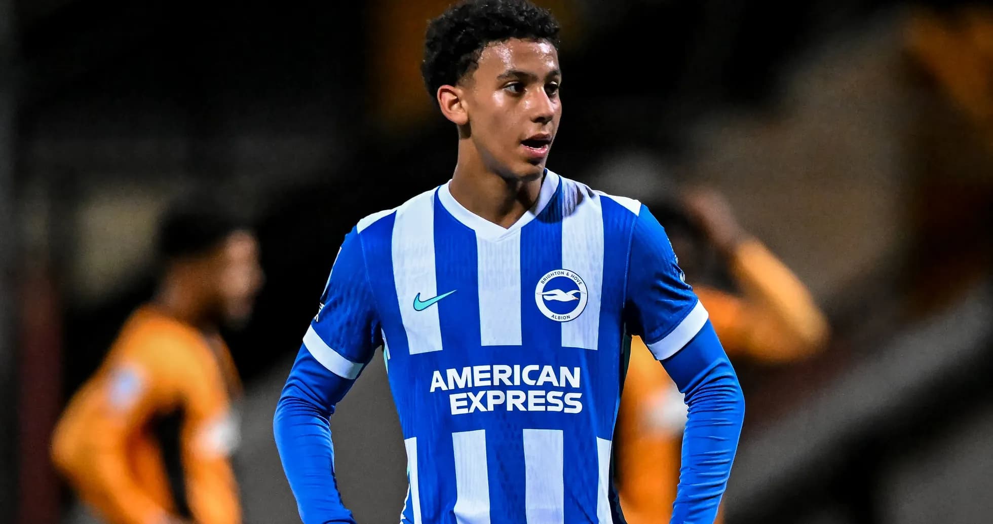 Brighton player in blue and white jersey during match