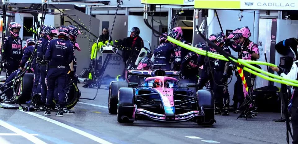 Alpine team performing a pit stop during race