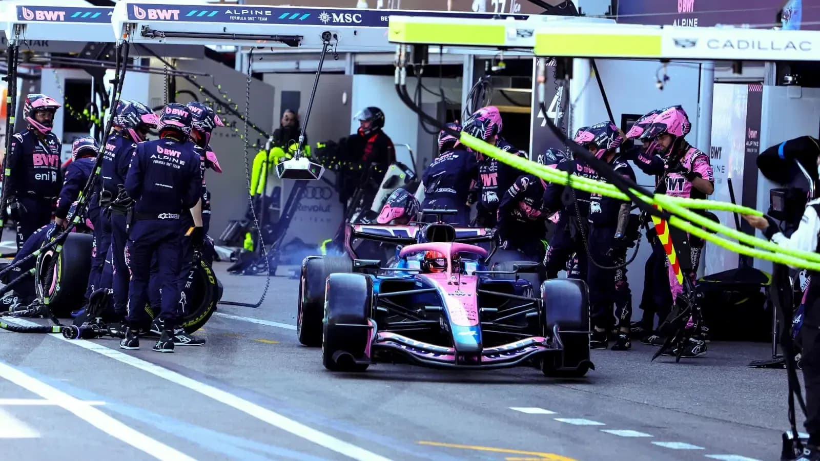 Alpine team performing a pit stop during race