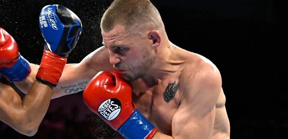 Boxer delivering a punch during a match