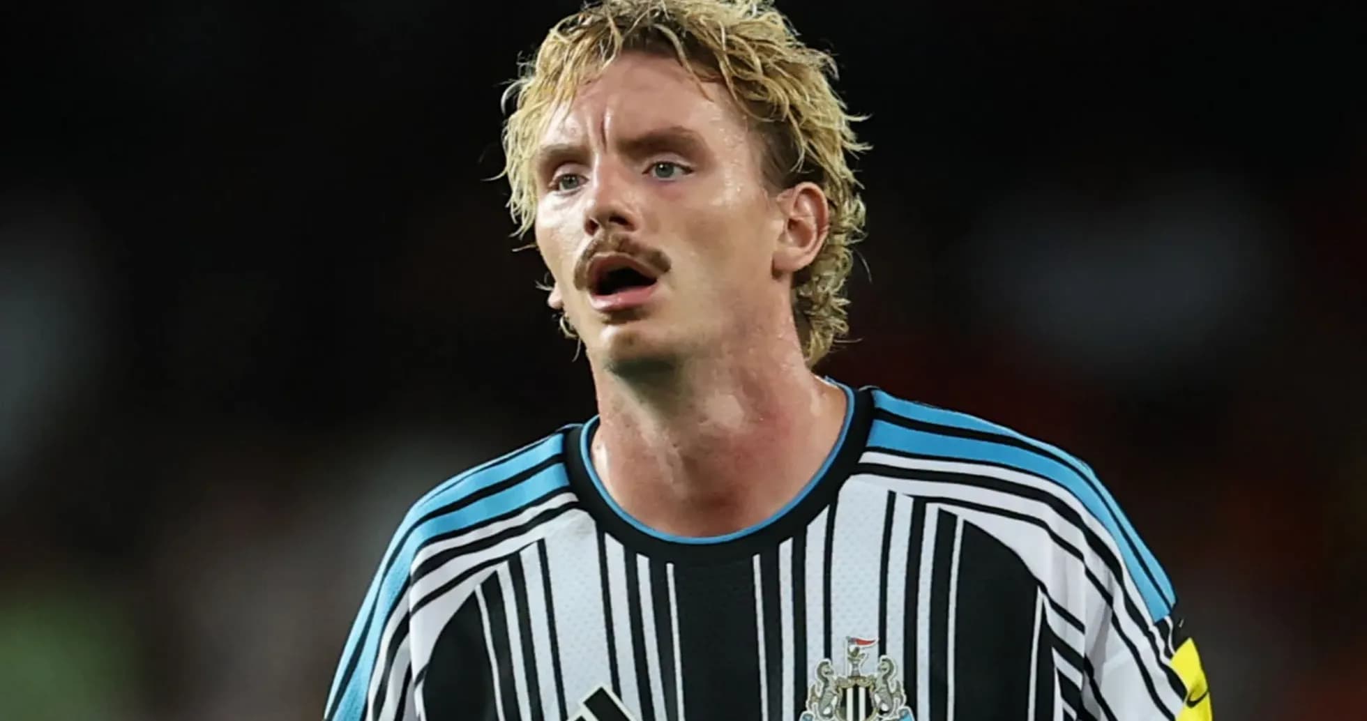 Newcastle United player in striped jersey during match