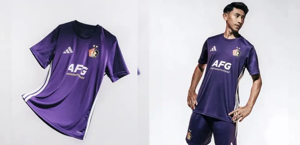 Purple football kit displayed on model and flat