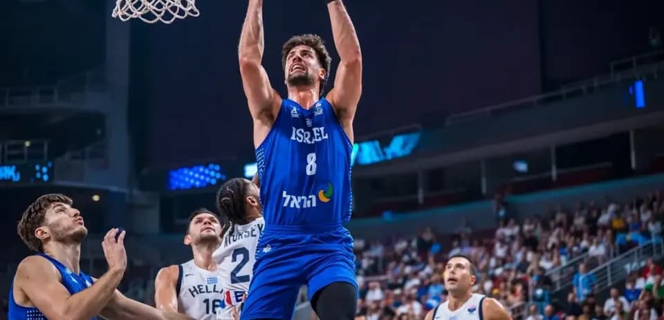 Player from Israel dunking during basketball game