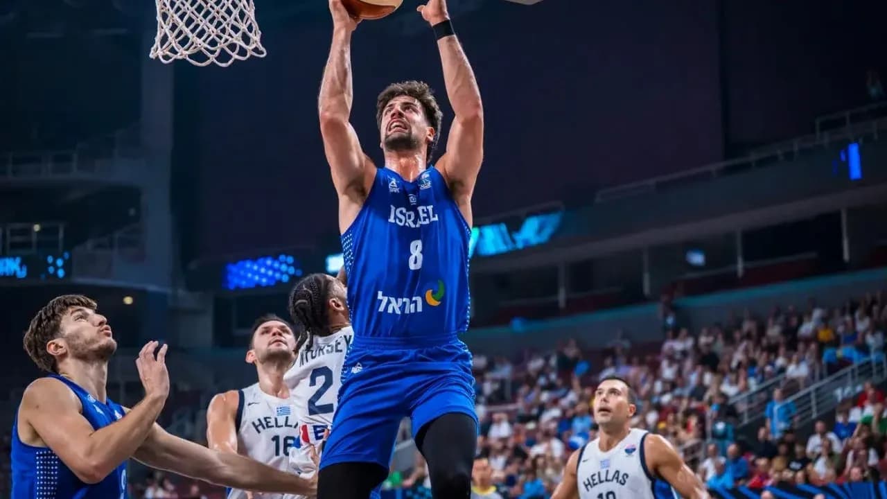 Player from Israel dunking during basketball game