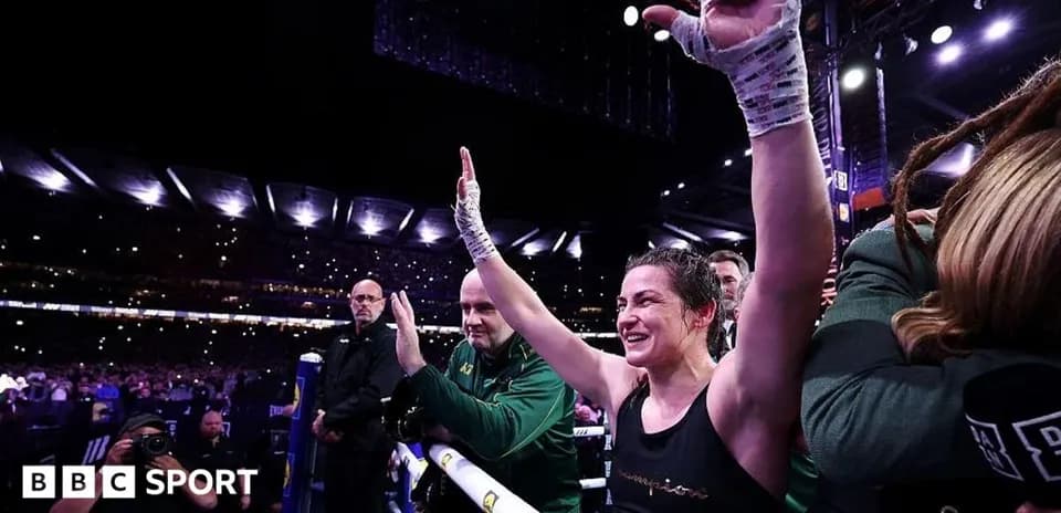 Boxer celebrating victory in the ring with fans