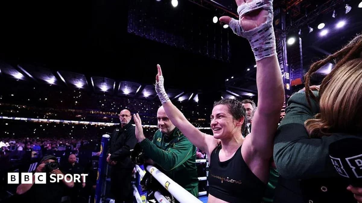 Boxer celebrating victory in the ring with fans