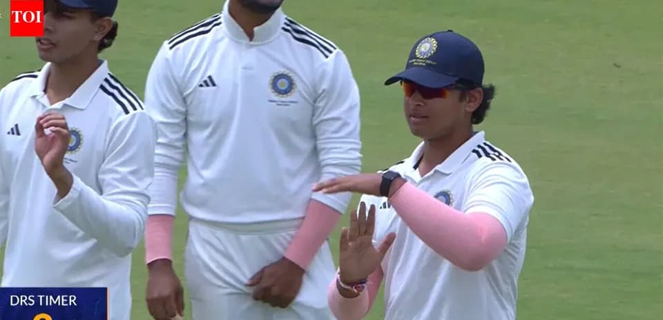 Cricket players discussing on the field during match