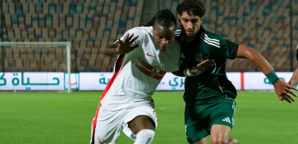 Two players battling for the ball during match