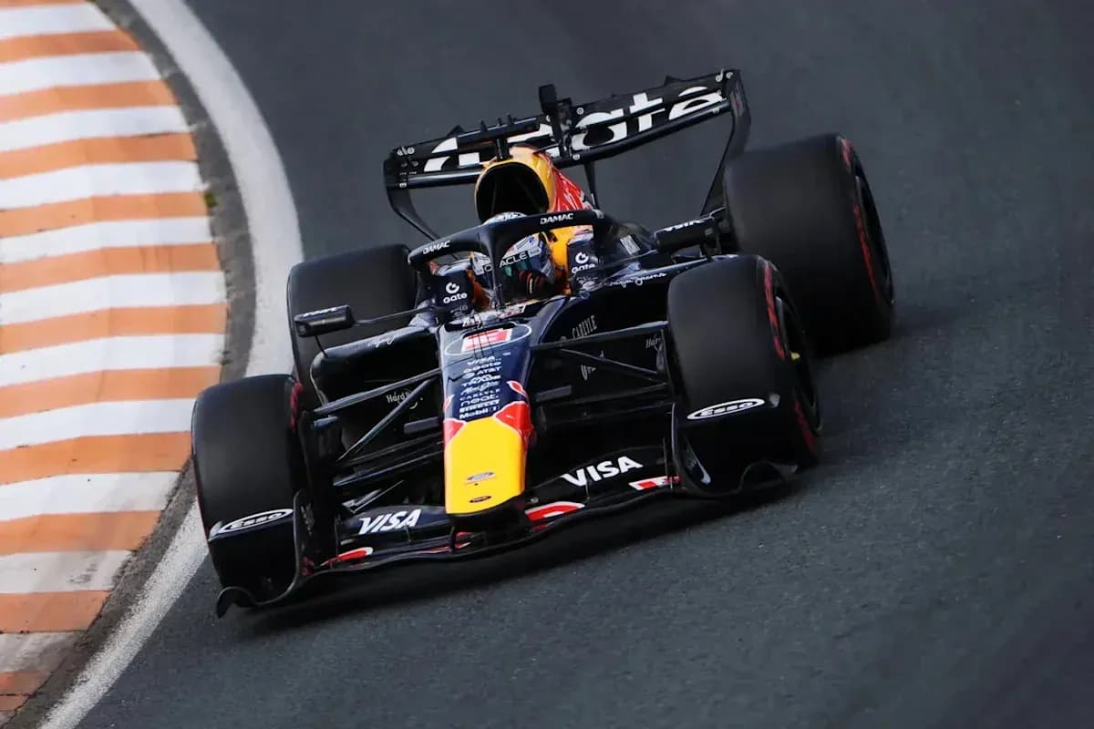 Formula 1 car navigating a sharp turn on track
