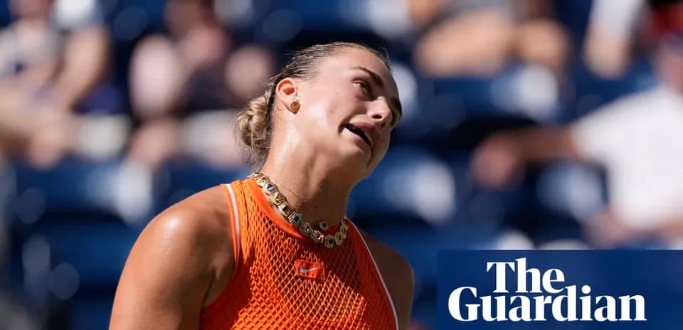 Tennis player reacting during a match in orange outfit