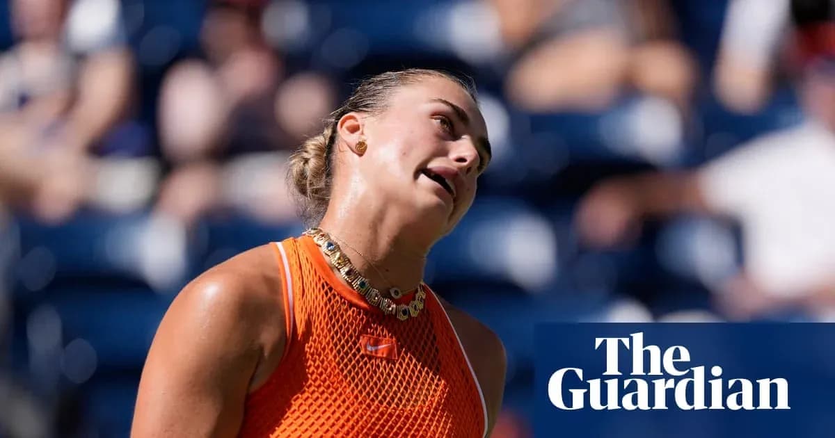 Tennis player reacting during a match in orange outfit
