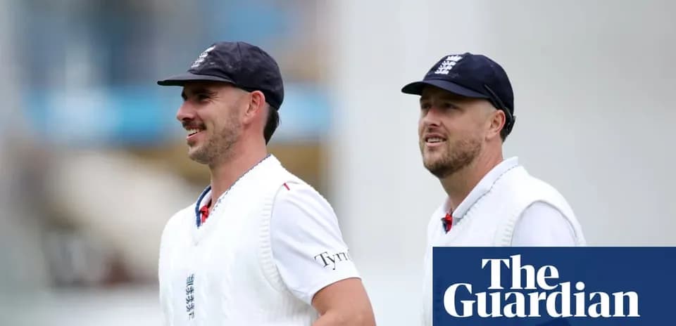 Two cricketers walking on the field in England