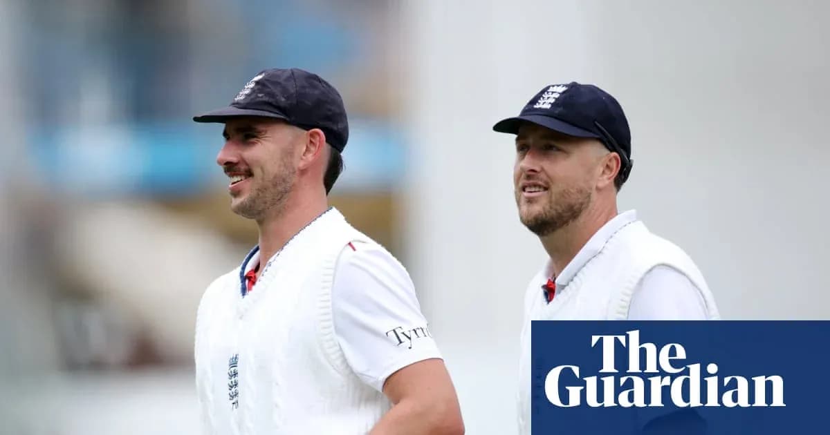 Two cricketers walking on the field in England