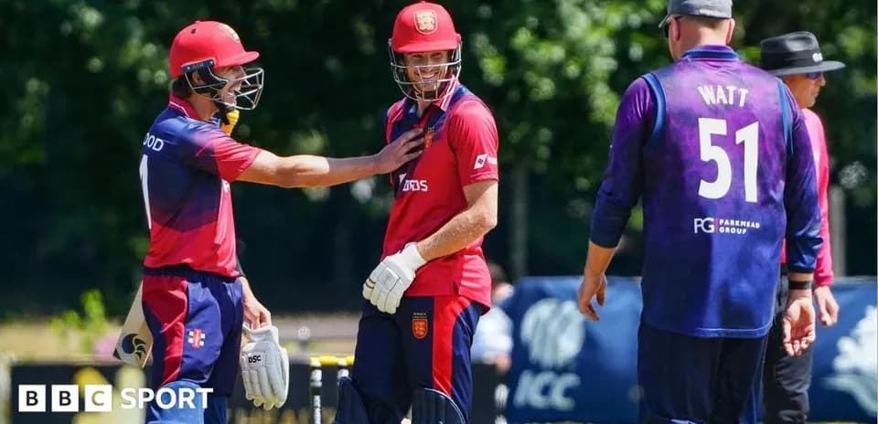 Players interacting during a cricket match