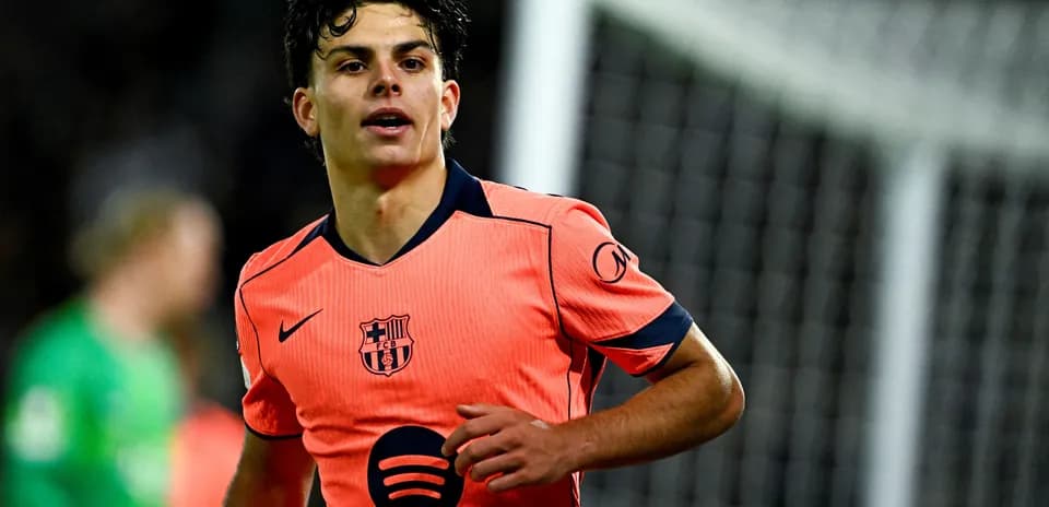 Player in orange Barcelona kit during match