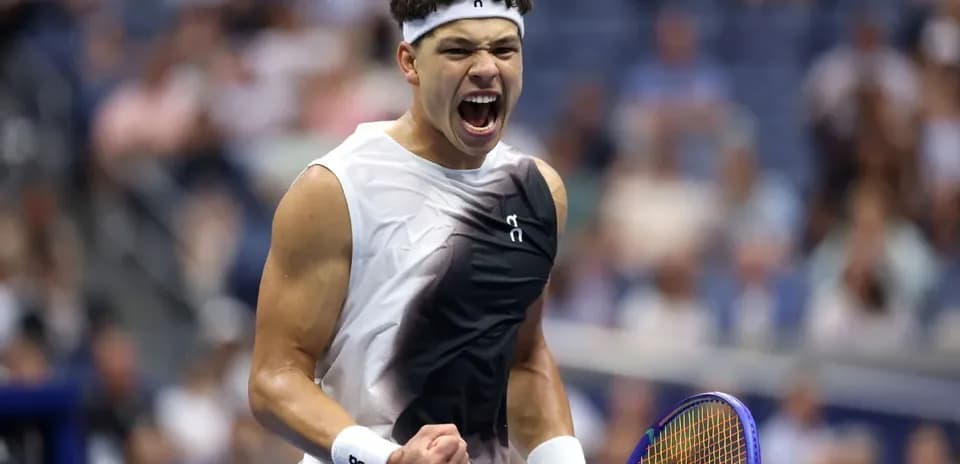 Tennis player celebrating after winning a point