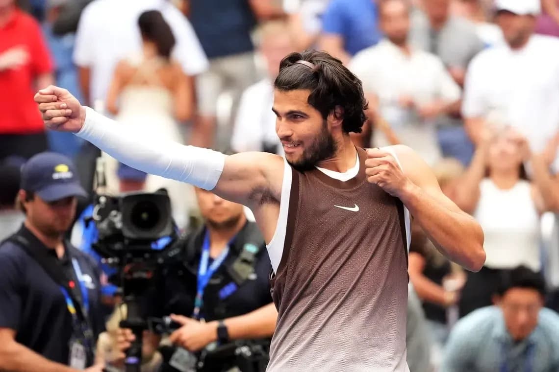 Tennis player celebrating with raised fist after match