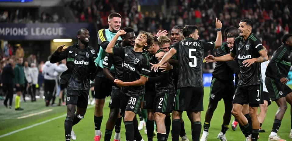 Players celebrating after scoring a goal in match