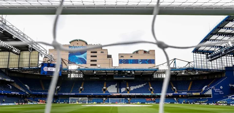 View of Stamford Bridge stadium through goal net