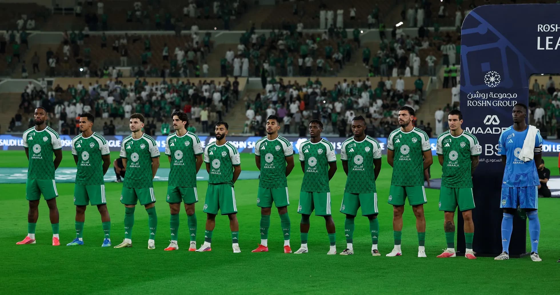 Football team lined up before match on field
