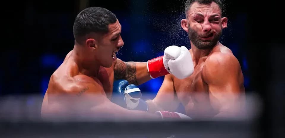 Boxers exchanging punches in the ring during match