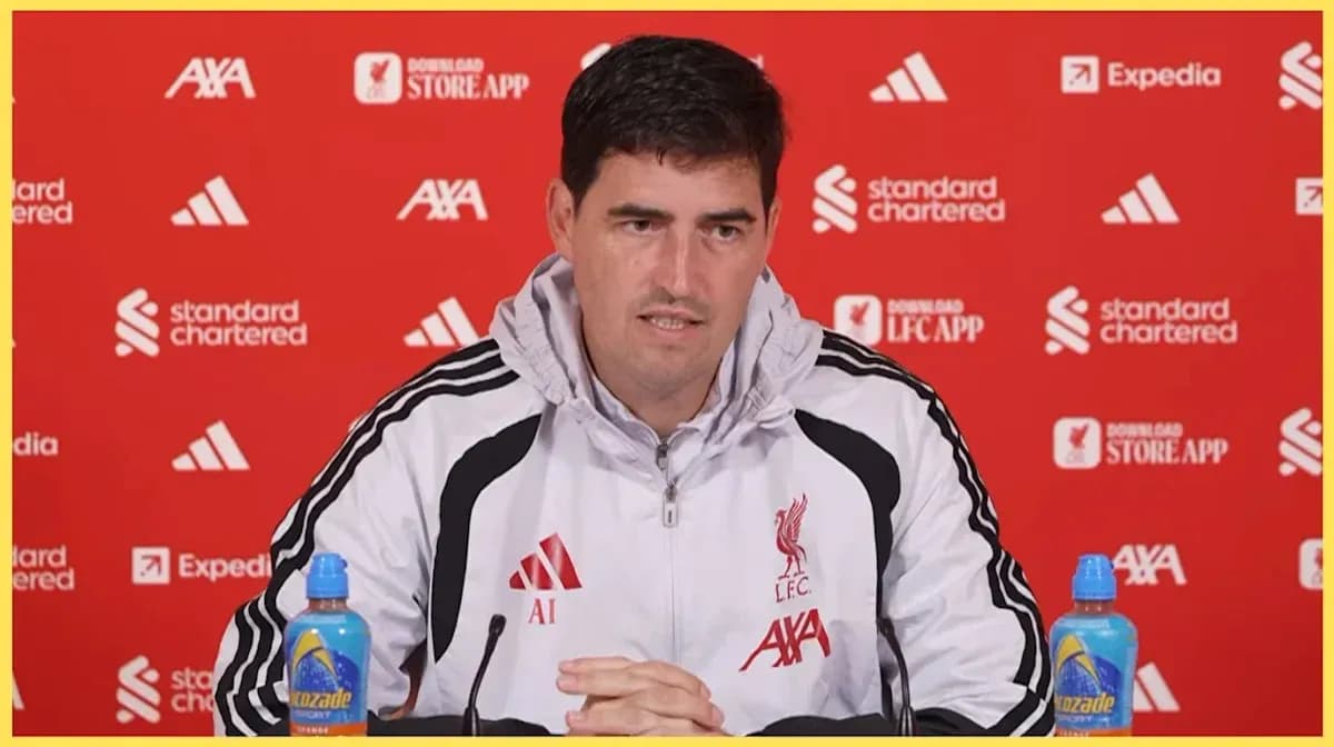 Manager speaking at Liverpool press conference table